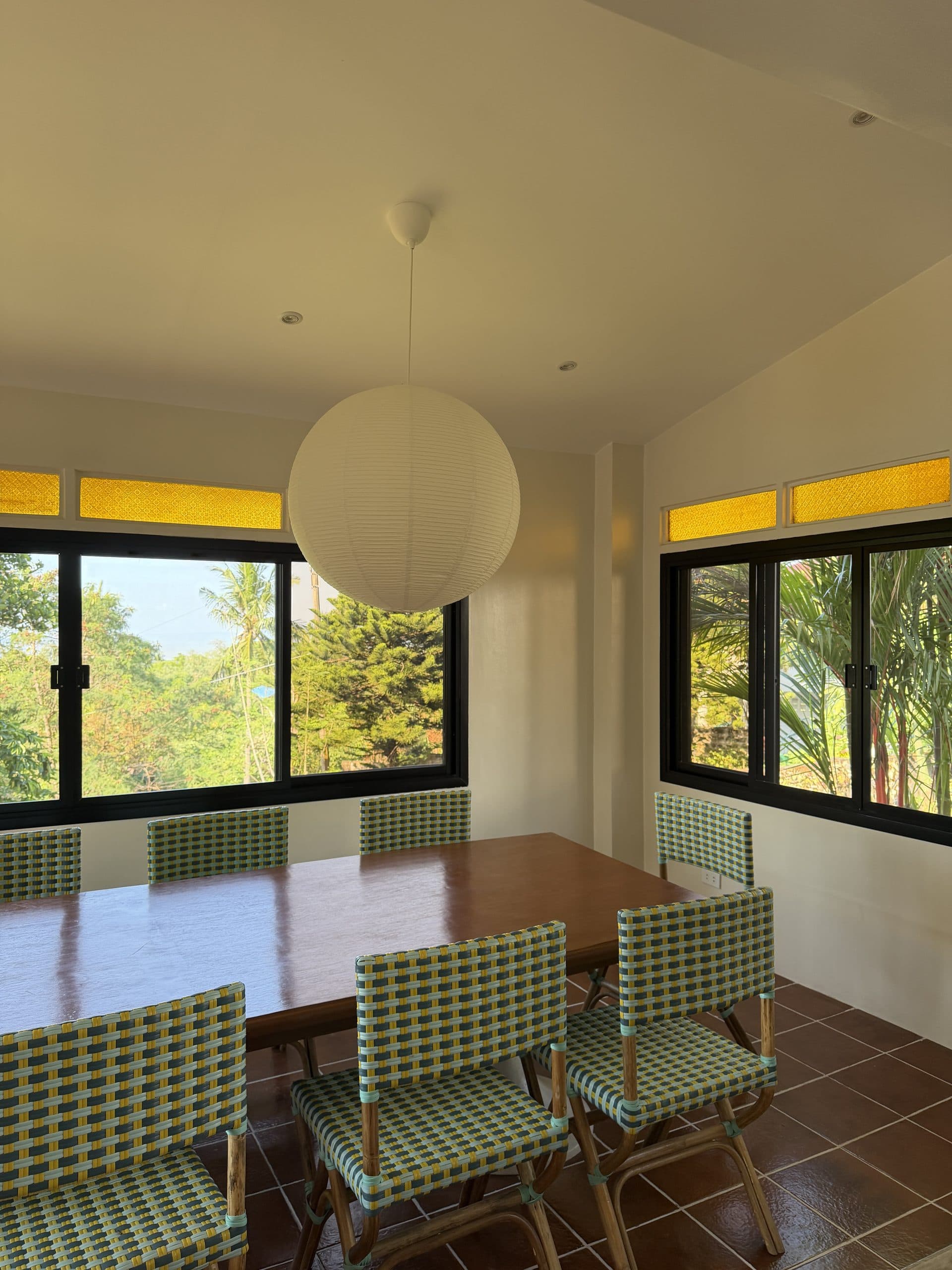 Bright dining room with garden views on two sides